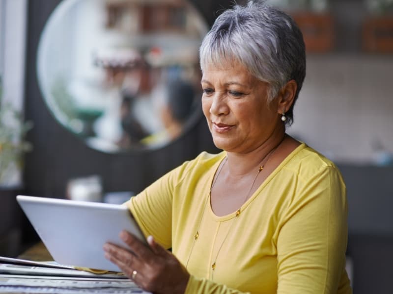 Image of Person holding Ipad